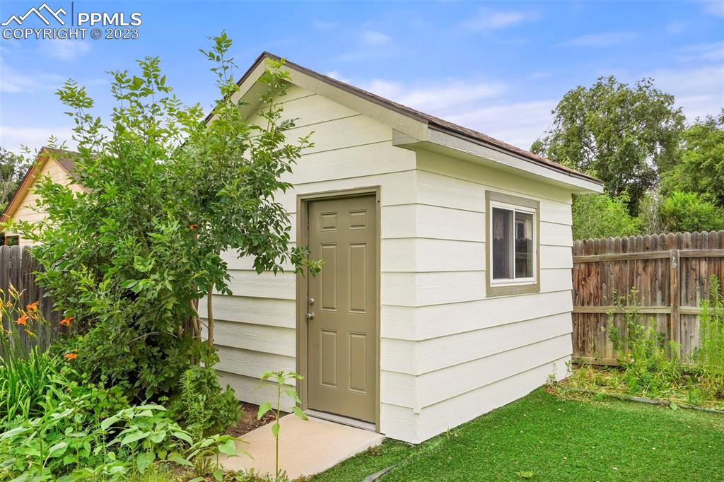 4748 Brant Road Colorado Springs, CO 80911 - Photo 18 of 19 a view of house with backyard