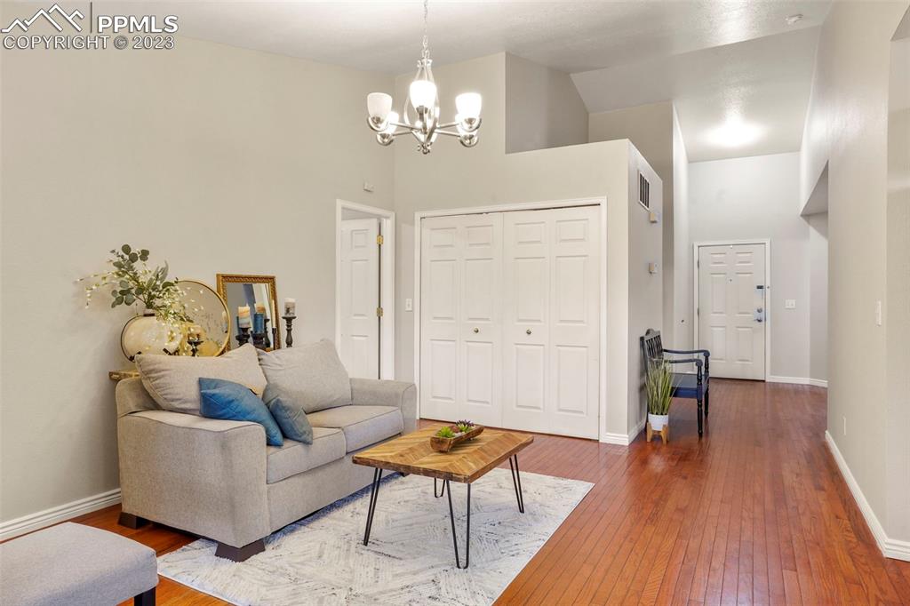 4748 Brant Road Colorado Springs, CO 80911 - Photo 3 of 19 a living room with furniture and a wooden floor