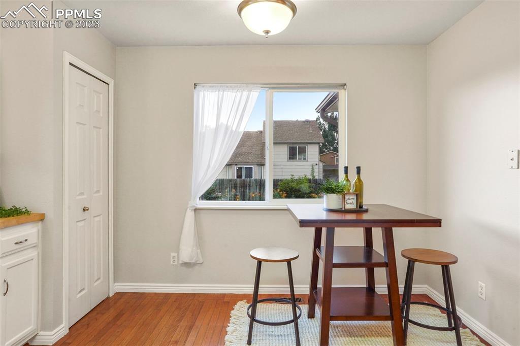 4748 Brant Road Colorado Springs, CO 80911 - Photo 6 of 19 a view of a room with furniture and wooden floor