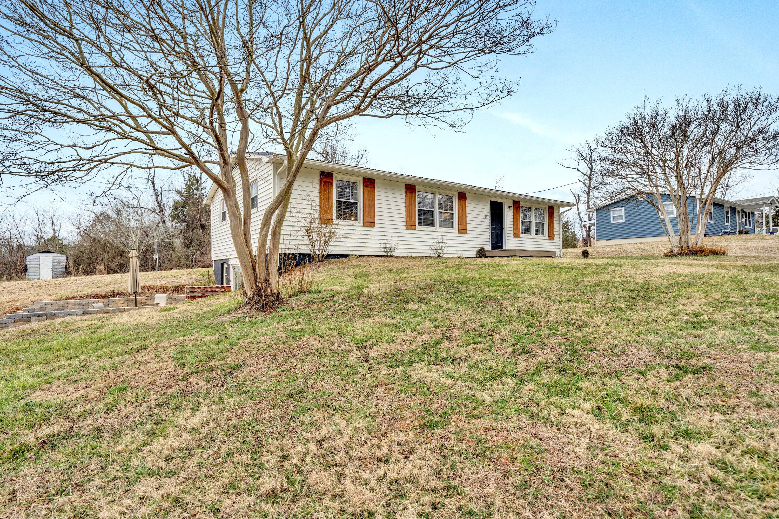 1465 Hardy Road Hardy, VA 24101 - Photo 2 of 32 a white house that has a tree in front of it