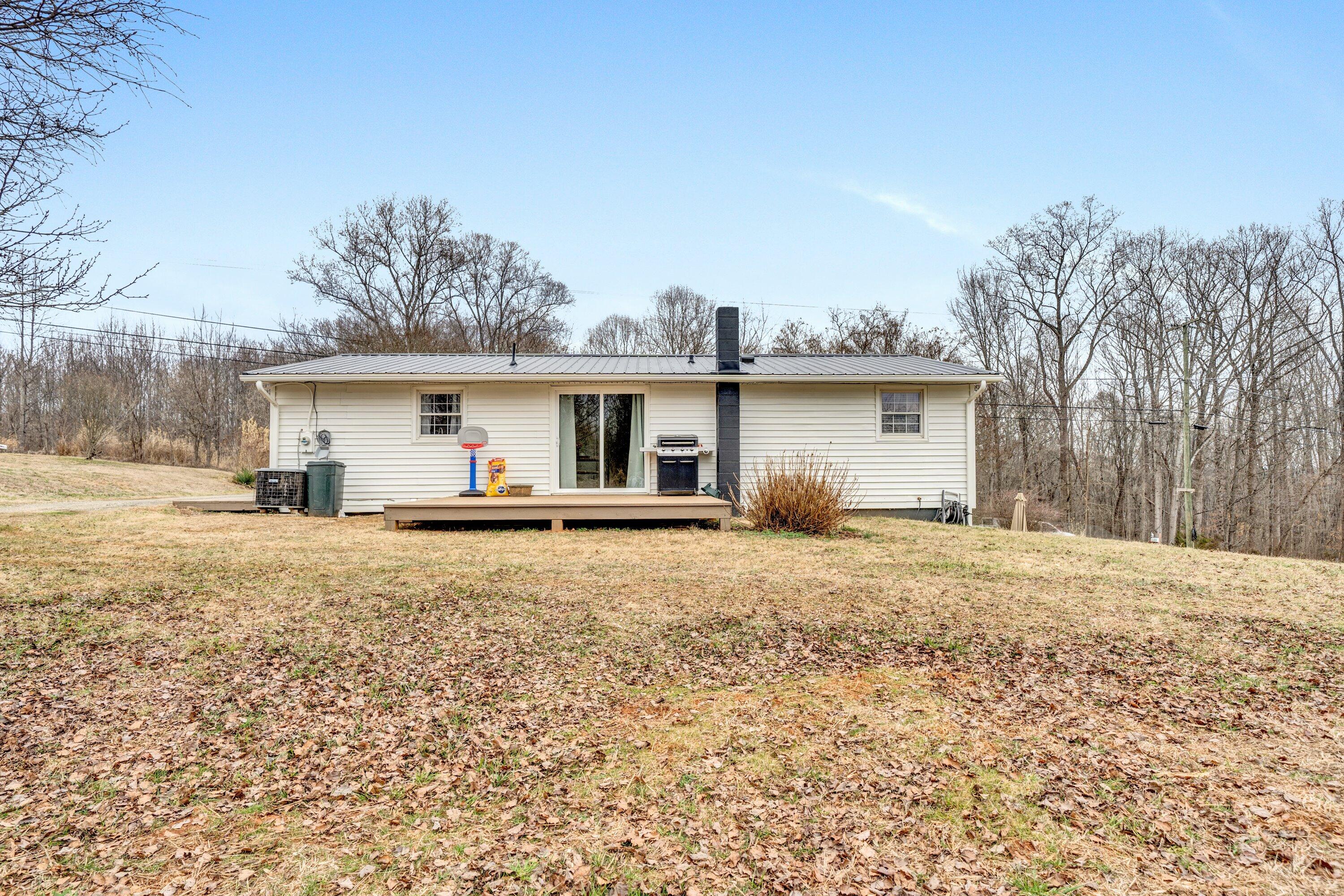 1465 Hardy Road Hardy, VA 24101 - Photo 3 of 32 a front view of house with yard and trees