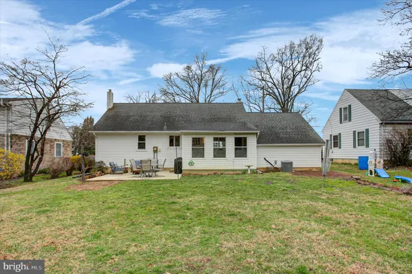 a front view of house with yard and seating area