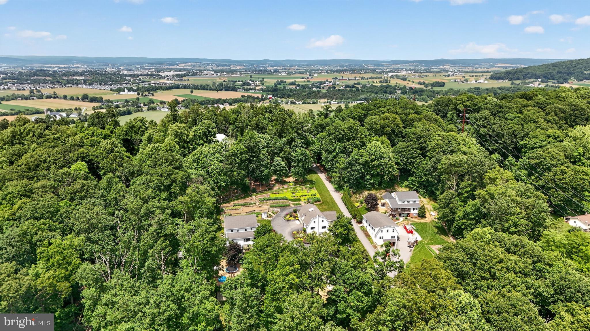 257 Hill Road New Holland, PA 17557 - Photo 13 of 94 Serene homes nestled in lush greenery.