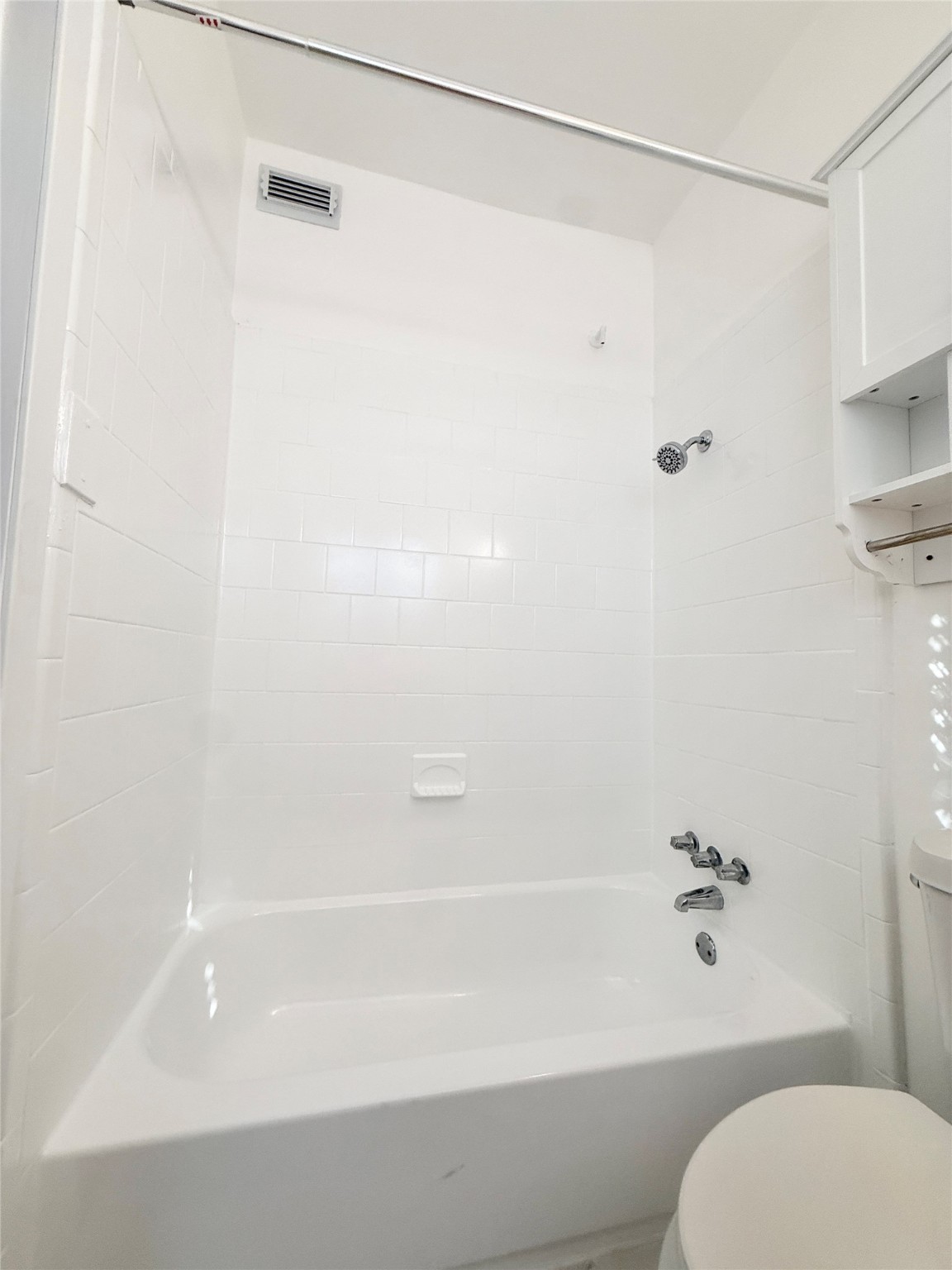 4021 Mandell Street, Unit D Houston, TX 77006 - Photo 13 of 13 a bathroom with a shower and a toilet