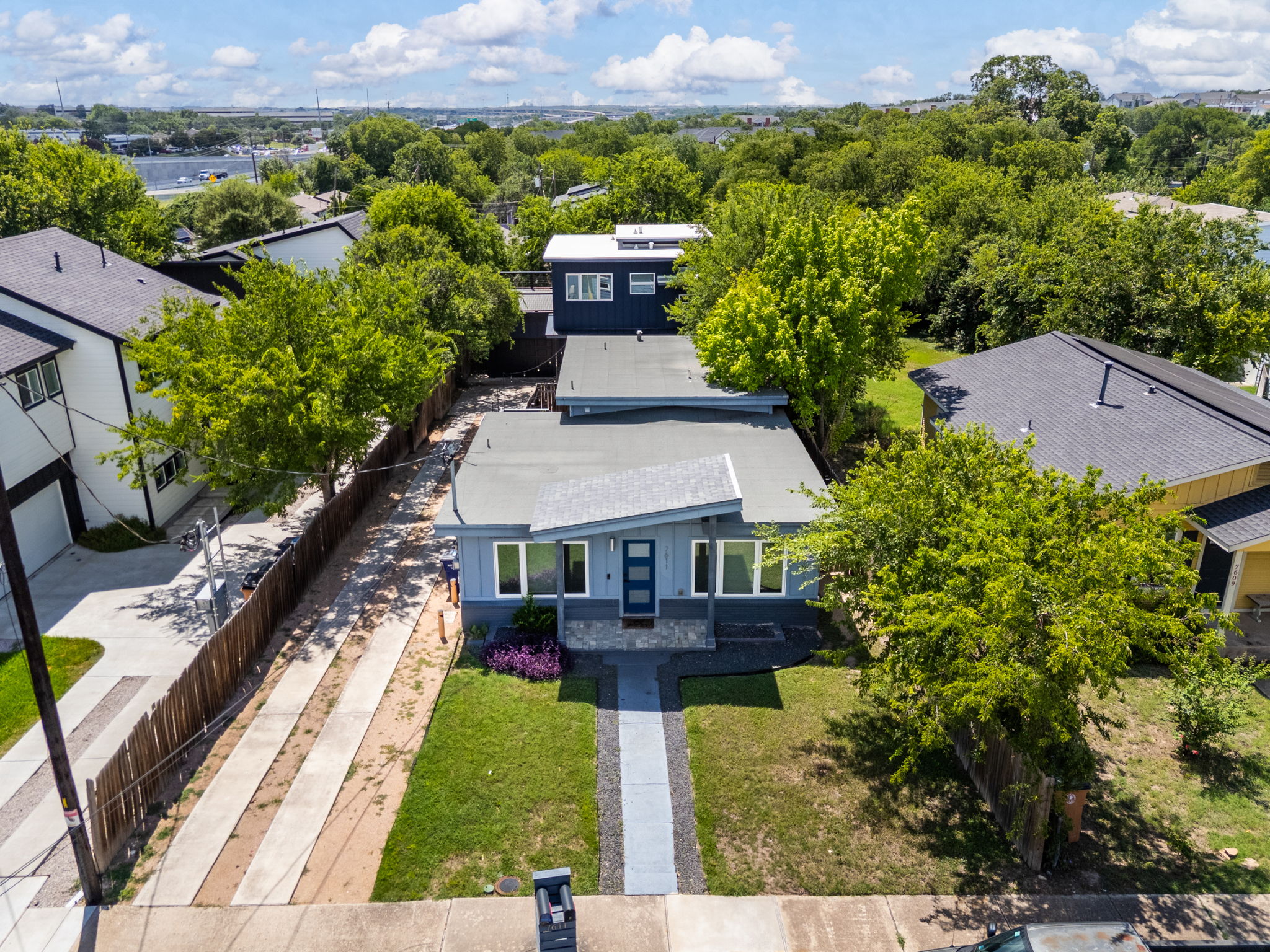 7611 Providence Avenue, Unit A Austin, TX 78752 - Photo 1 of 40 an aerial view of a house with a yard and lake view