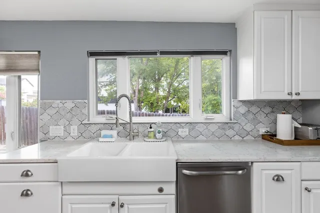 a kitchen with a sink and a window
