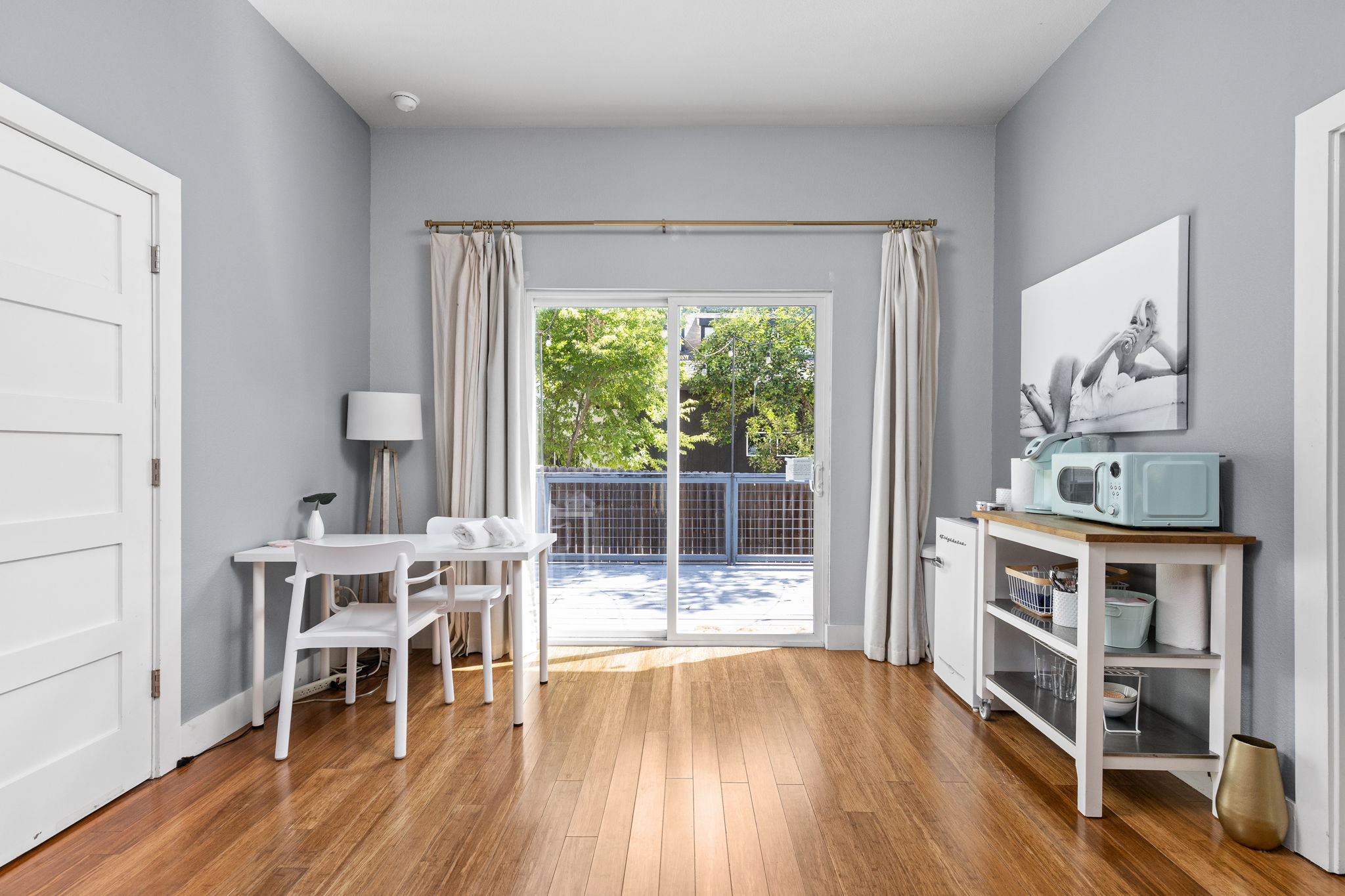 7611 Providence Avenue, Unit A Austin, TX 78752 - Photo 20 of 40 a view of a workspace with furniture and wooden floor