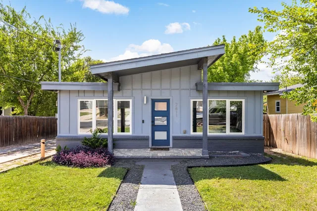 a front view of a house with garden
