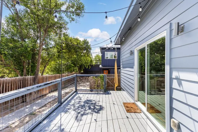 a view of a balcony with wooden floor