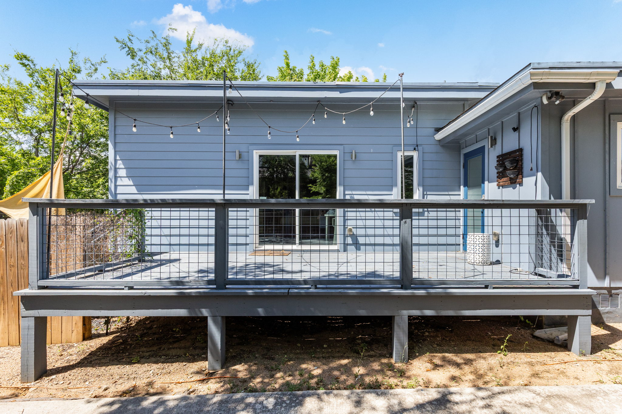 7611 Providence Avenue, Unit A Austin, TX 78752 - Photo 33 of 40 a view of a balcony with two chairs and a potted plant