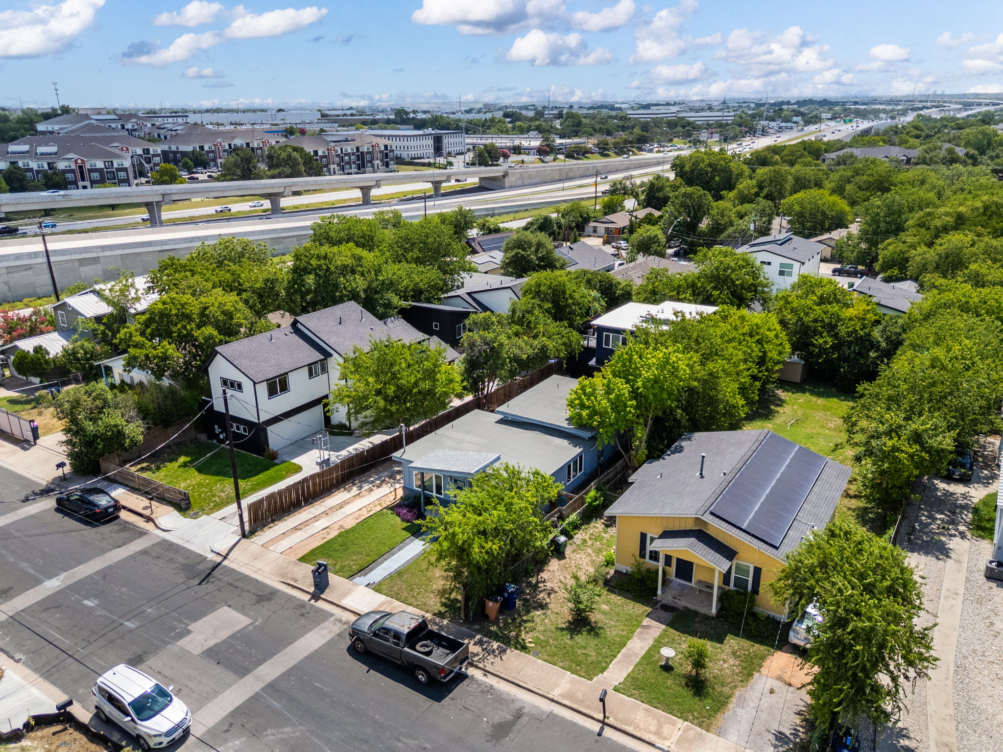 7611 Providence Avenue, Unit A Austin, TX 78752 - Photo 34 of 40 an aerial view of a house with a garden and lake view