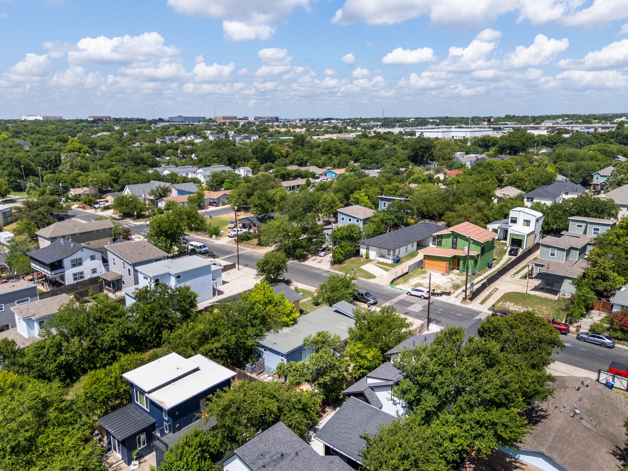 7611 Providence Avenue, Unit A Austin, TX 78752 - Photo 40 of 40 an aerial view of a city with lots of residential buildings and mountain view in back