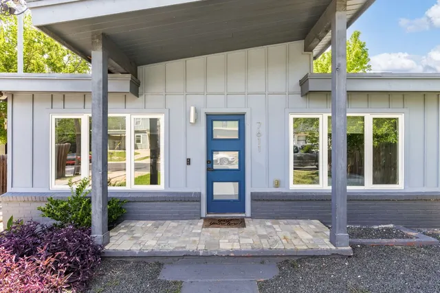 a view of a brick house with front door