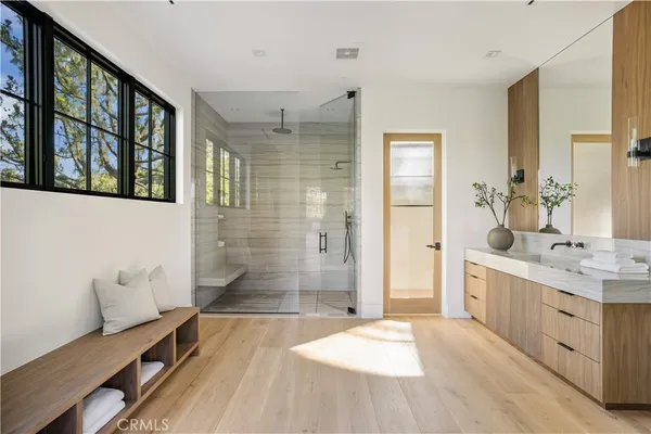 a living room with furniture a rug and a window