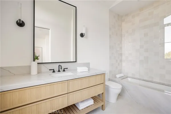 a bed room with two couches and a couch