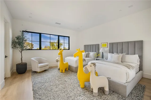 a bathroom with a granite countertop sink a toilet and a mirror