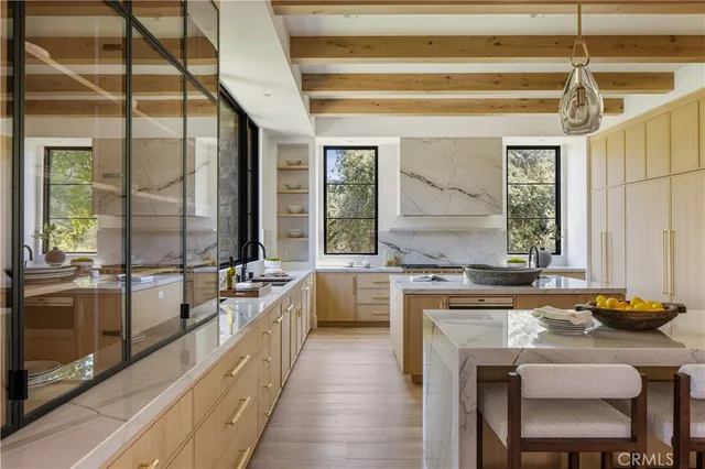 a kitchen with a stove a sink and a refrigerator