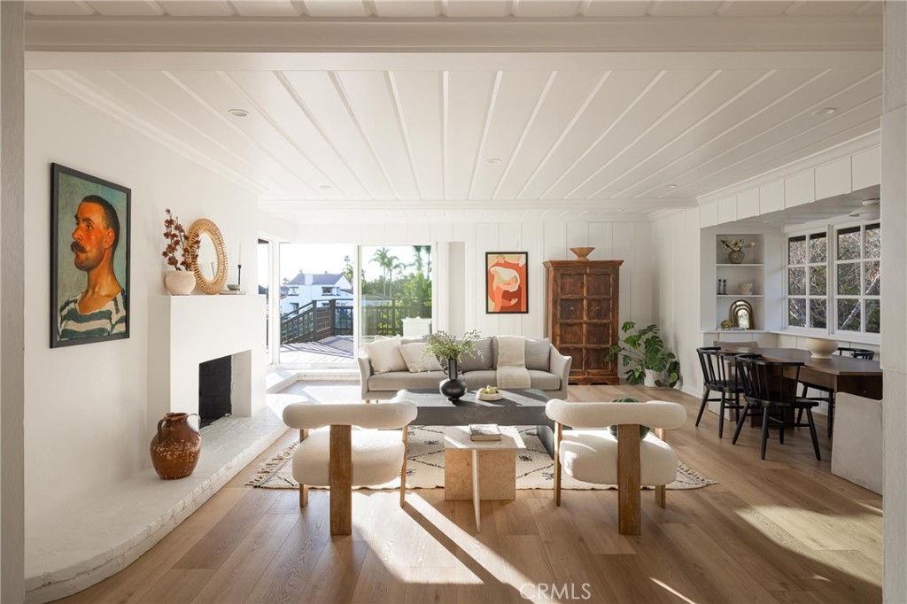 1825 Avocado Road Oceanside, CA 92054 - Photo 1 of 1 a living room with furniture a fireplace and a table