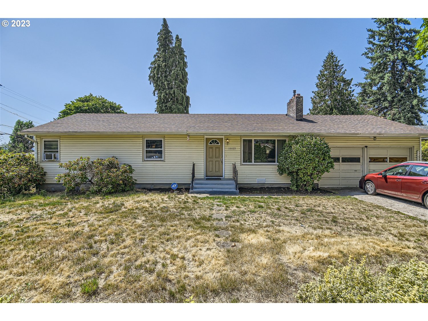 14409 Southeast Oatfield Road Milwaukie, OR 97267 - Photo 1 of 24 a view of a house with a garden