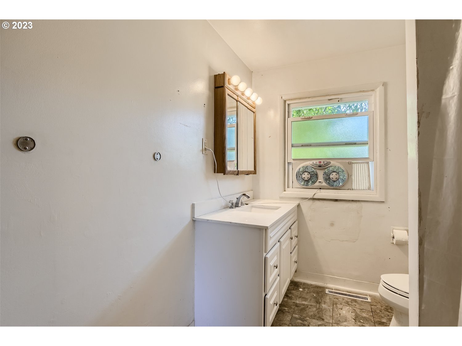 14409 Southeast Oatfield Road Milwaukie, OR 97267 - Photo 13 of 24 a bathroom with a sink a toilet and mirror