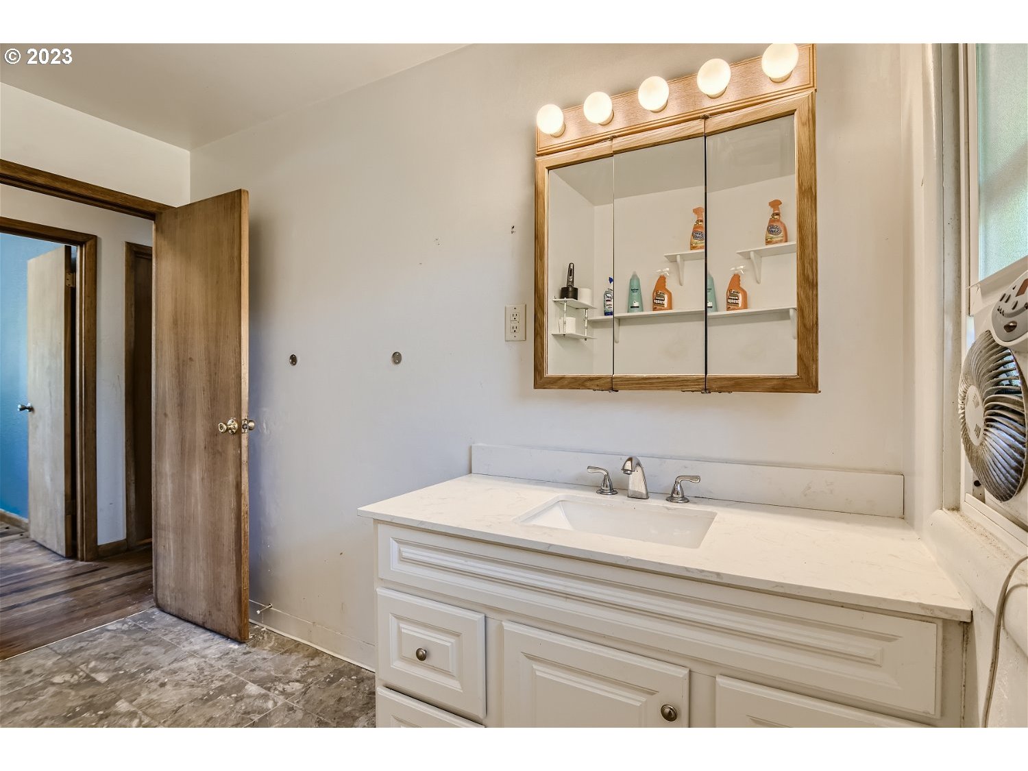 14409 Southeast Oatfield Road Milwaukie, OR 97267 - Photo 14 of 24 a bathroom with a sink a mirror and a vanity