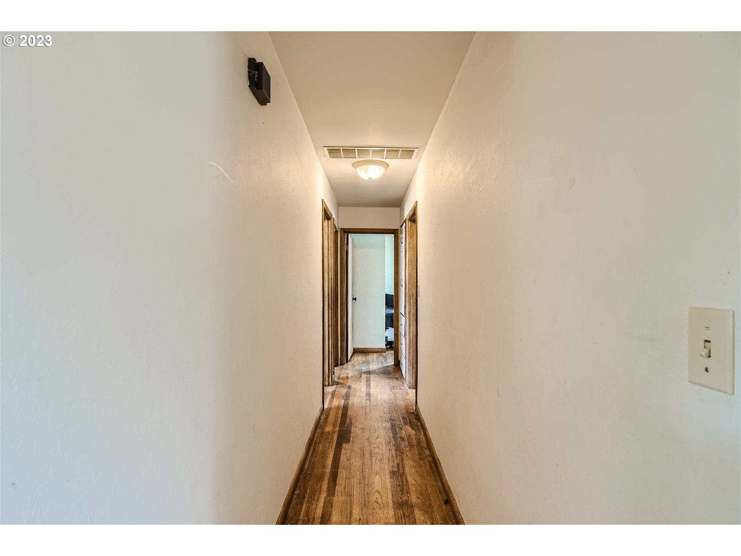14409 Southeast Oatfield Road Milwaukie, OR 97267 - Photo 17 of 24 a view of a hallway with wooden floor