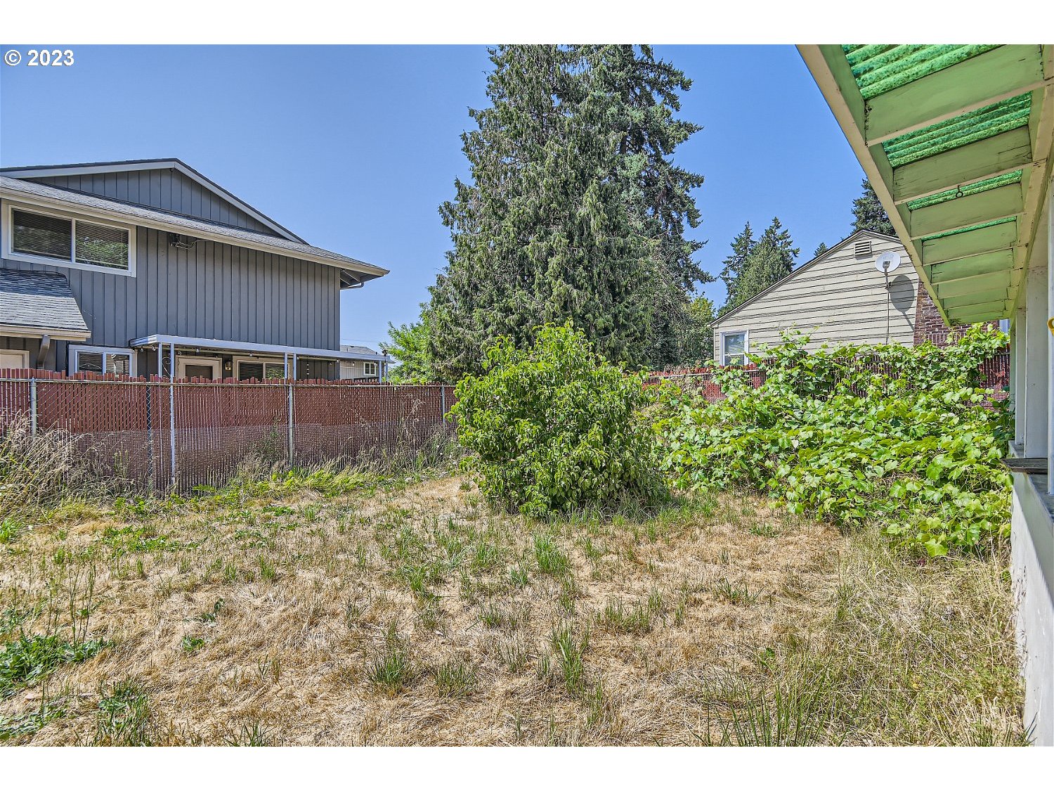 14409 Southeast Oatfield Road Milwaukie, OR 97267 - Photo 21 of 24 a view of a house with a yard