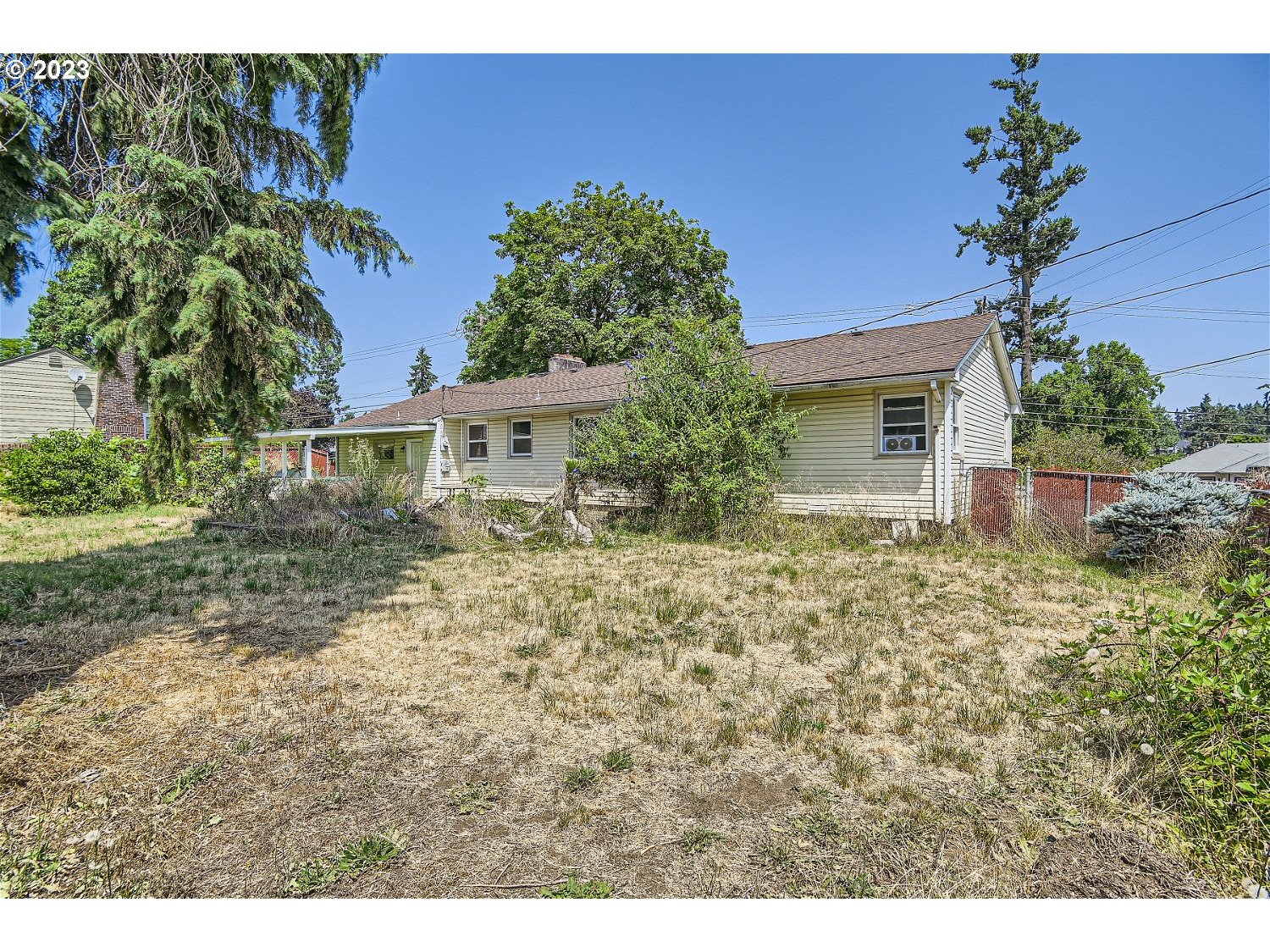 14409 Southeast Oatfield Road Milwaukie, OR 97267 - Photo 23 of 24 a house with lots of trees