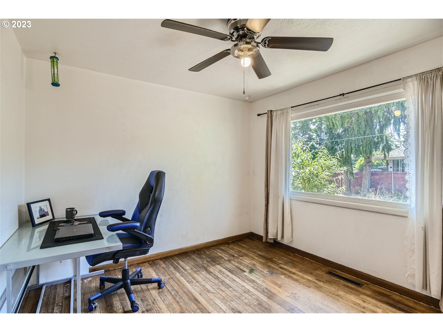 14409 Southeast Oatfield Road Milwaukie, OR 97267 - Photo 6 of 24 a view of a workspace with furniture and a window