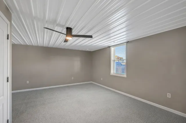 a view of a house with a big yard