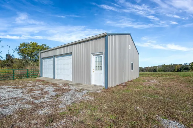 a view of a house with backyard porch and furniture