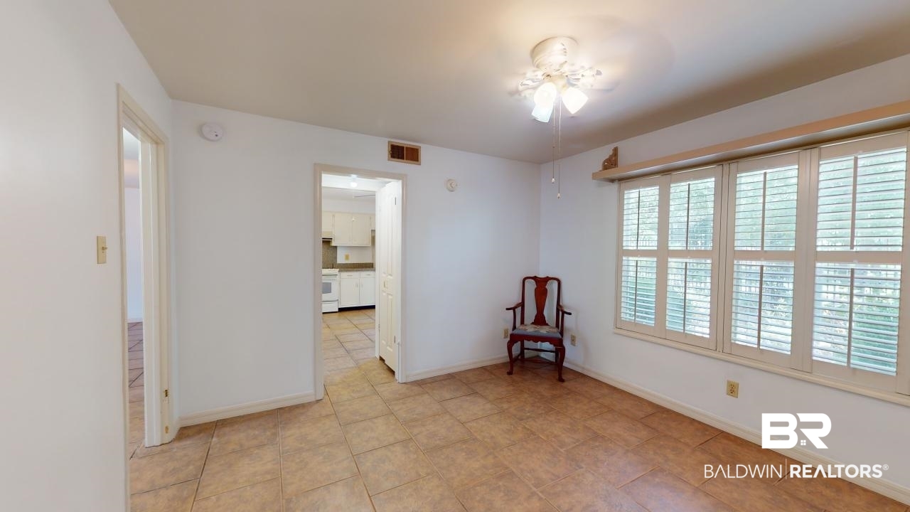 4009 Old Shell Road, Unit C13 Mobile, AL 36608 - Photo 20 of 32 Unfurnished room with baseboards, light tile patterned flooring, and ceiling fan