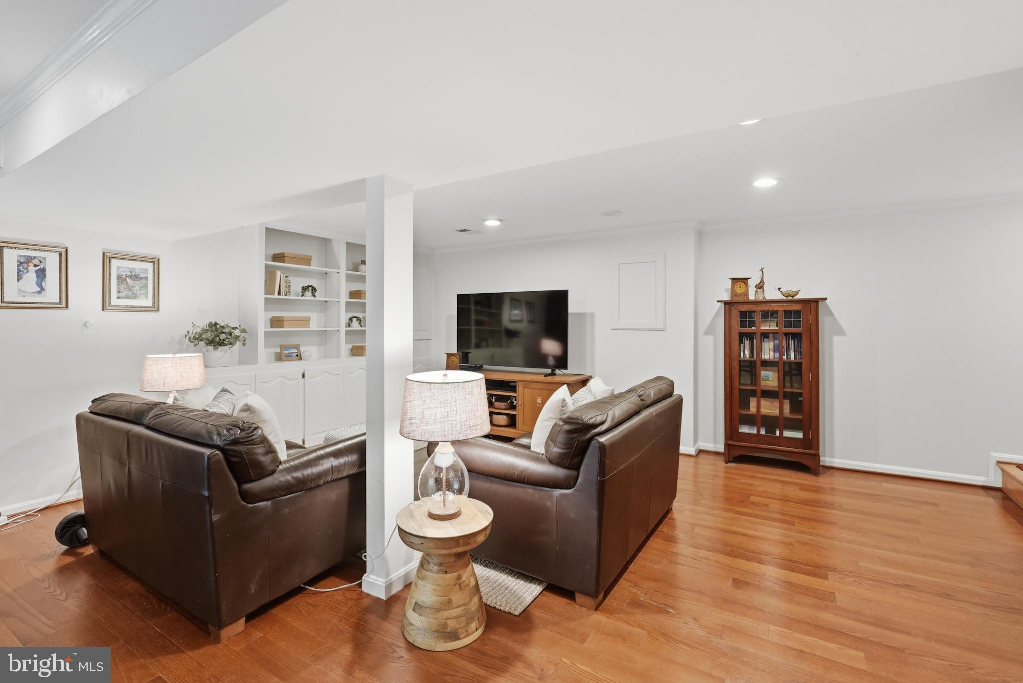 7006 Barnack Drive Springfield, VA 22152 - Photo 38 of 56 a living room with furniture and wooden floor
