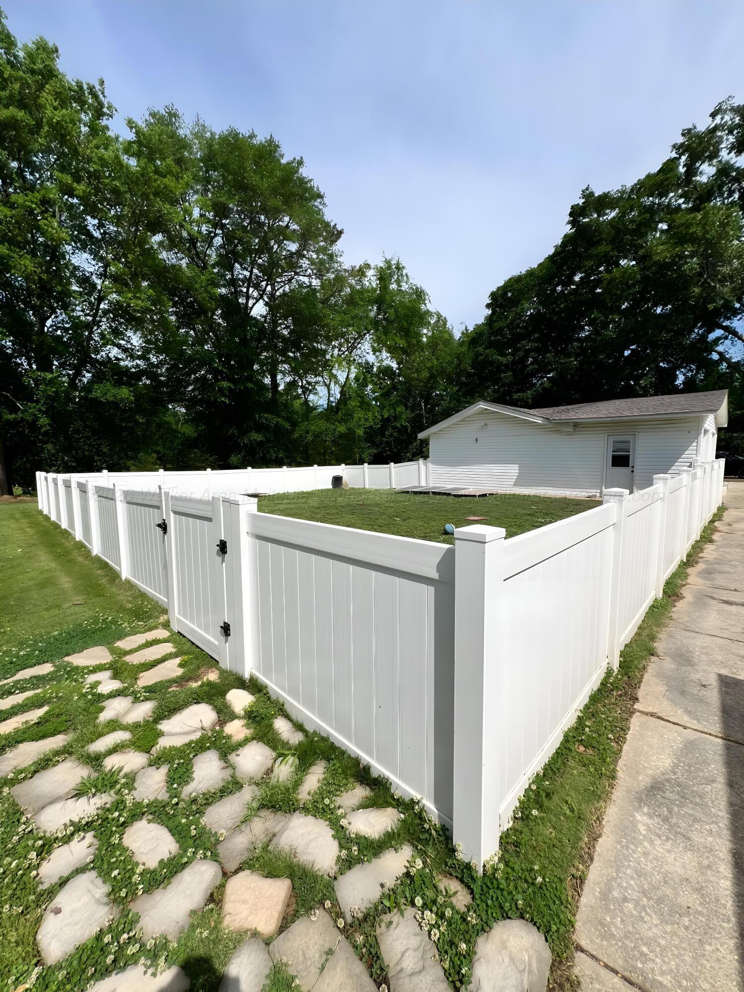1751 North Walston Bridge Road Jasper, AL 35504 - Photo 43 of 52 New vinyl fenced backyard section off of detached garage.