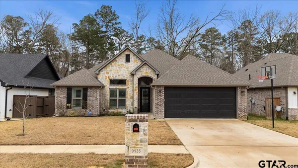 a front view of a house with a garage