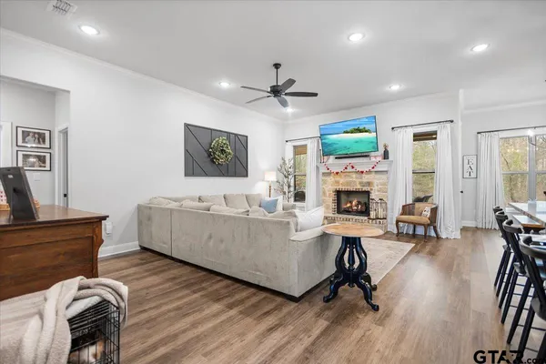 a living room with furniture fireplace and a flat screen tv