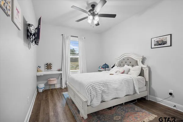 a bedroom with a bed and a table in it