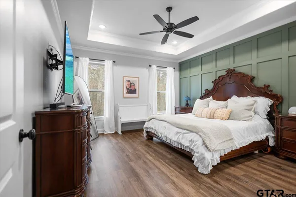 a bedroom with a bed and a mirror