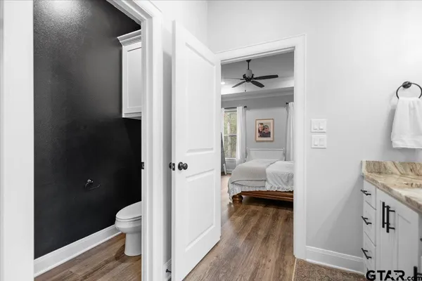 a en suite bathroom with a sink and a toilet