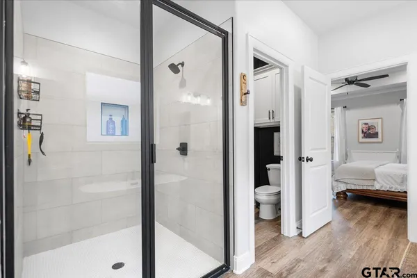 a bathroom with a tub and shower