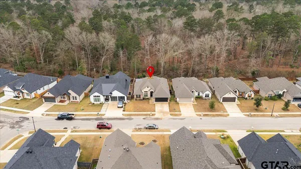 a view of a house with outdoor space and seating area