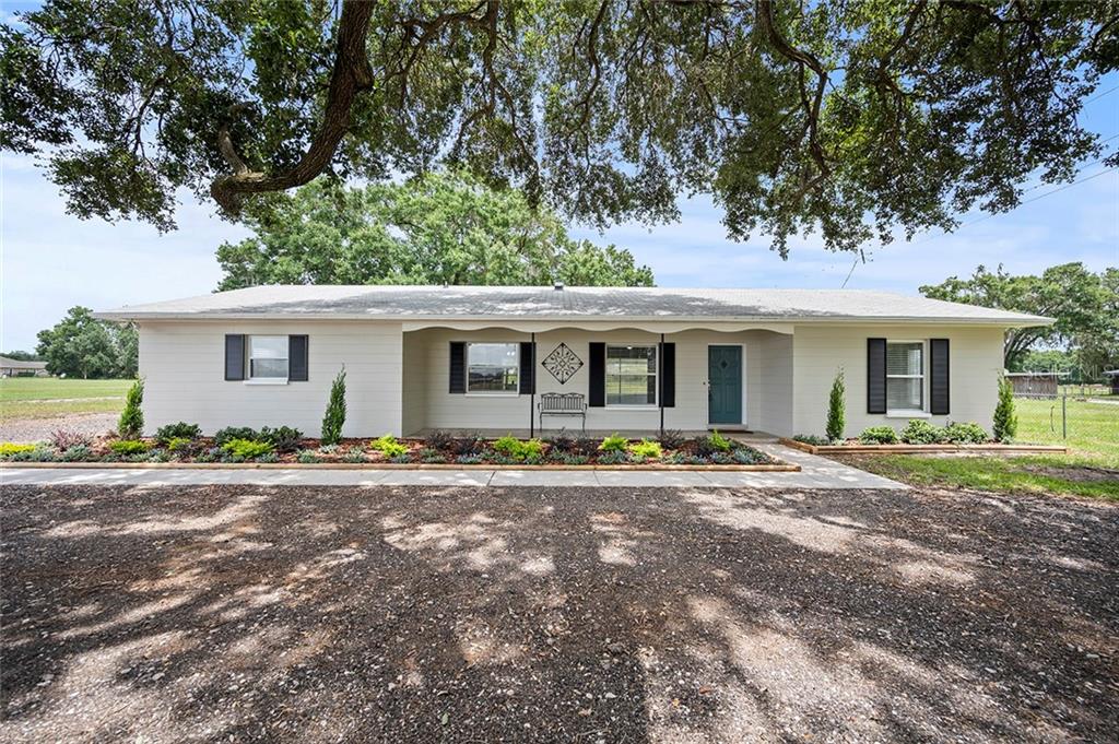 4013 Gallagher Road Dover, FL 33527 - Photo 1 of 1 front view of a house with a patio