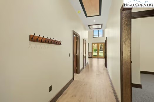 790 Howard Edmisten Road Sugar Grove, NC 28679 - Photo 19 of 45 a view of a hallway with wooden floor and windows