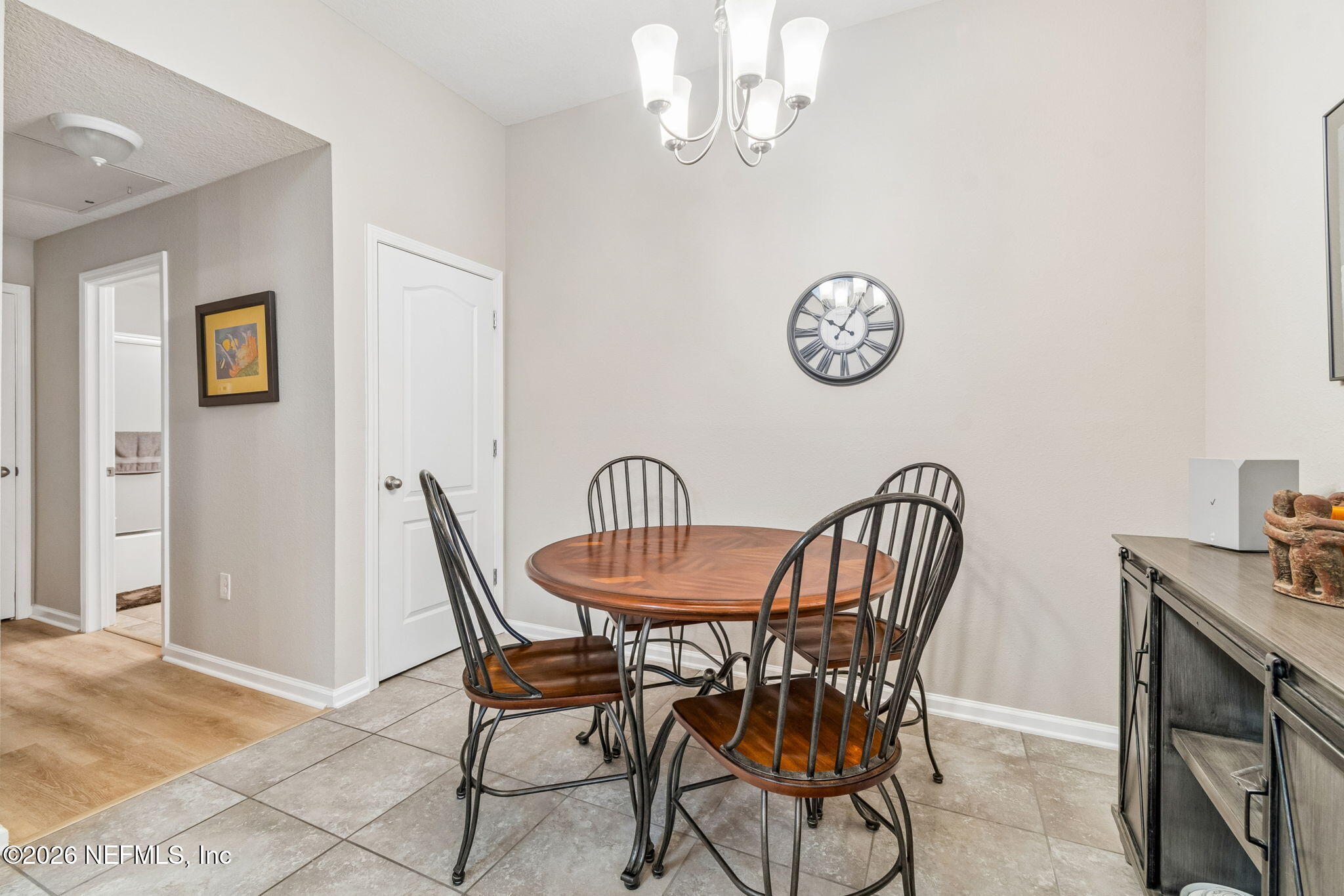2113 Golden Lake Loop St. Augustine, FL 32084 - Photo 12 of 50 a view of a dining room with furniture and table and chandelier