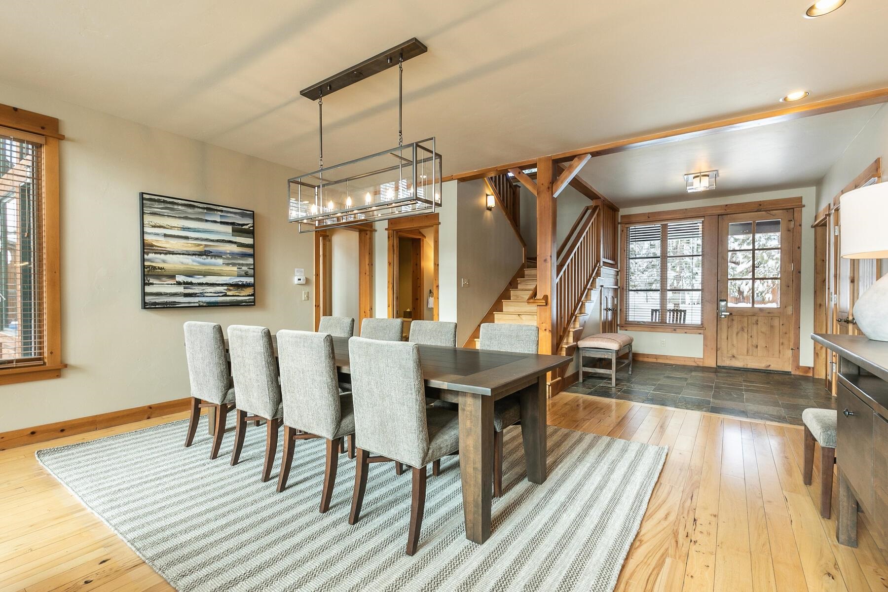 12423 Lookout Loop, Unit F1526 Truckee, CA 96161 - Photo 8 of 28 a view of a dining room with furniture wooden floor and chandelier