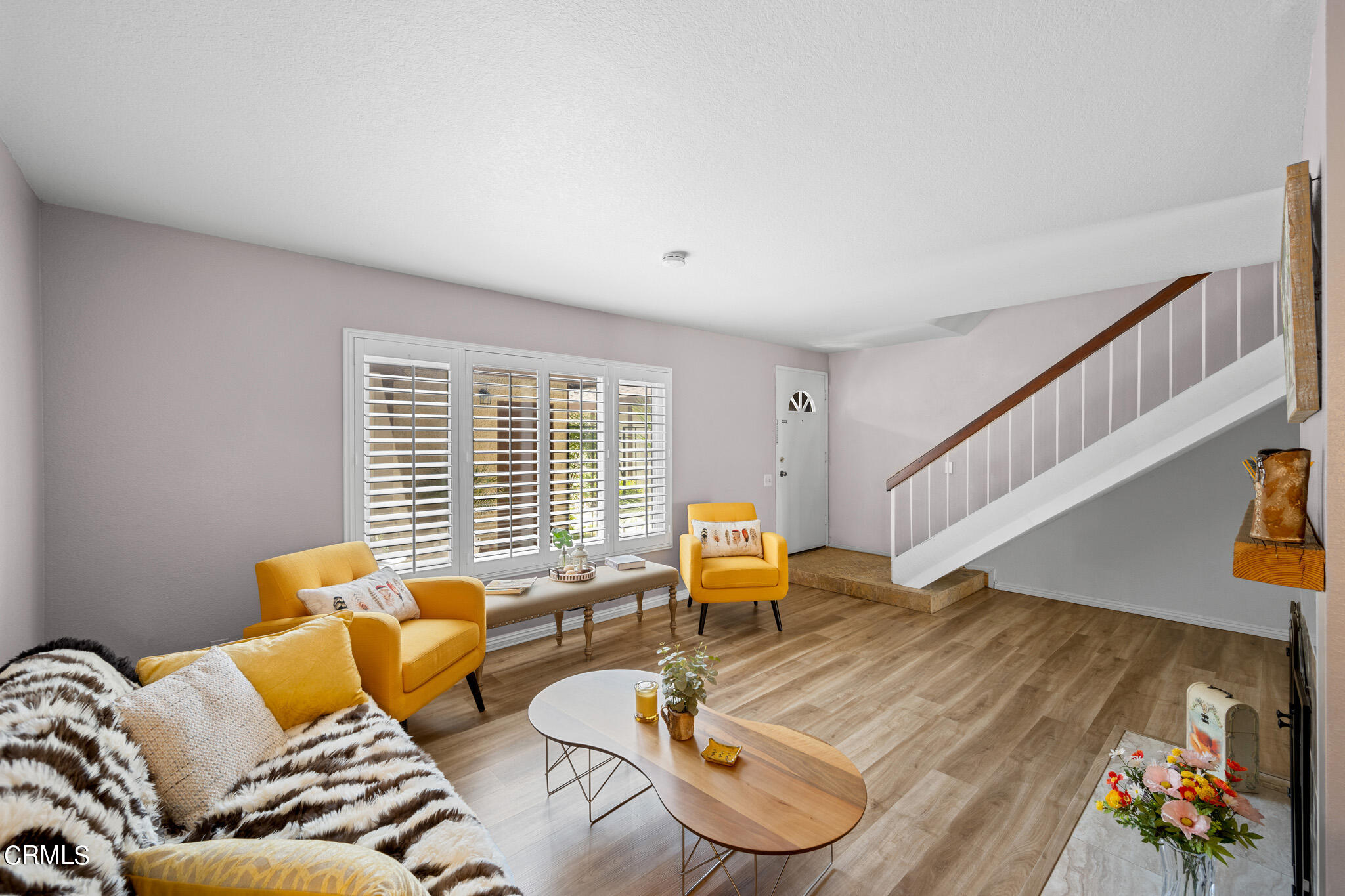 2041 Windsor Circle Duarte, CA 91010 - Photo 4 of 19 a couch sitting in a bedroom next to a window