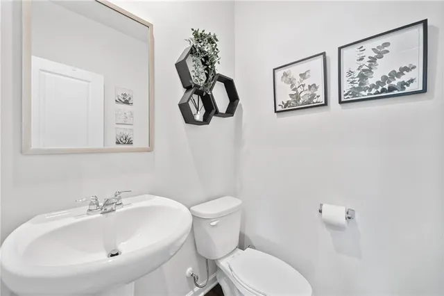 a bathroom with a toilet and a sink