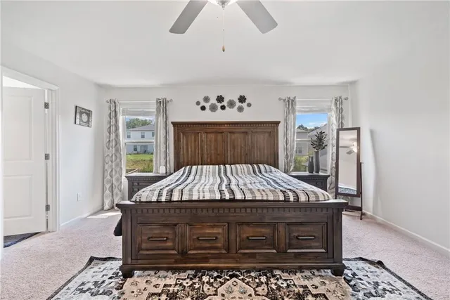 a room with a bed and a table in it