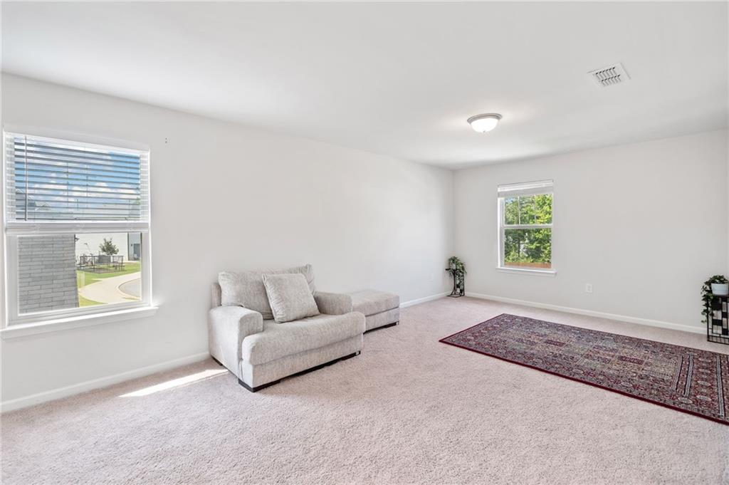 368 Murray Way Lilburn, GA 30047 - Photo 26 of 54 a living room with furniture and a window