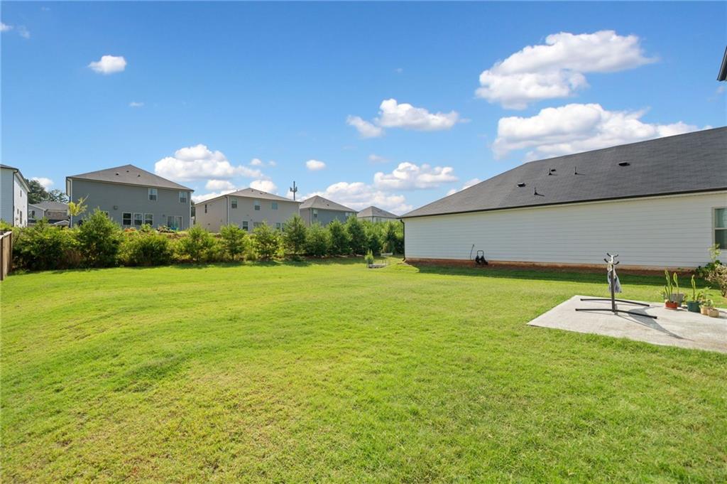 368 Murray Way Lilburn, GA 30047 - Photo 38 of 54 a view of a house with a backyard